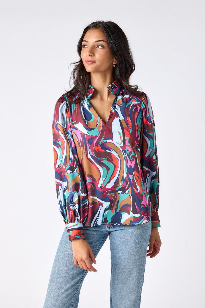Crosby Lyla Blouse, back view on-model, full-length showing ruffled collar and sleeve print