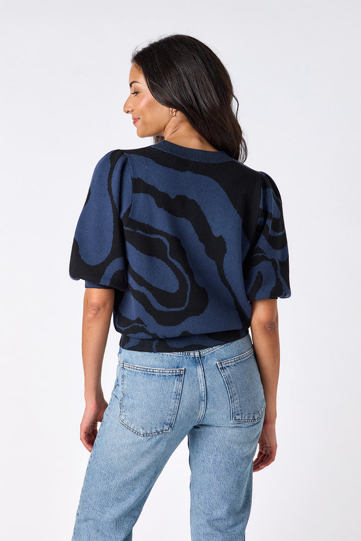 Crosby Smith Ink Wave Sweater, back view on-model, full-length showing wave print and puff sleeves