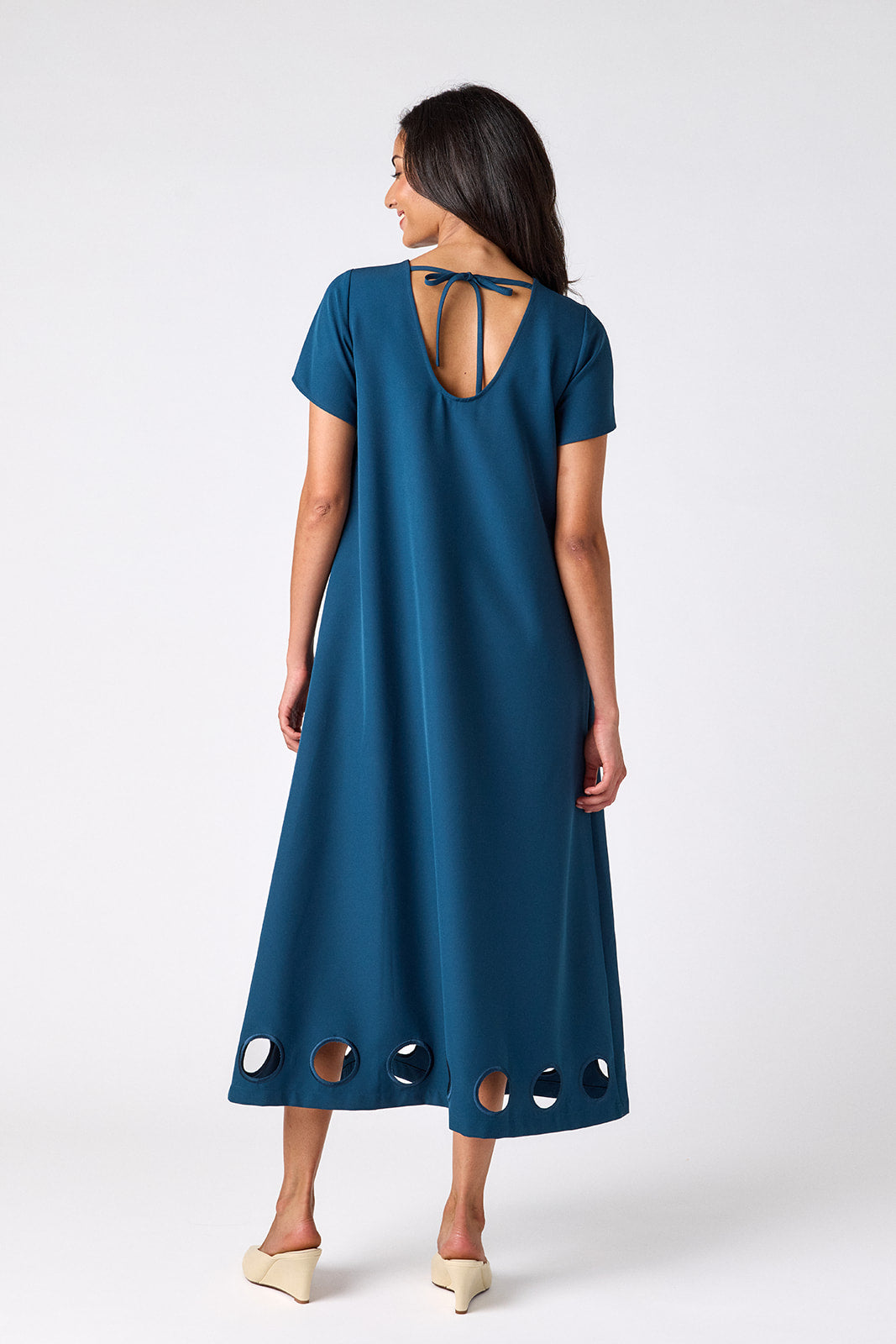 Crosby Coco Dress in Midnight — back view showing scooped back neckline with tie closure and hem cutout detail