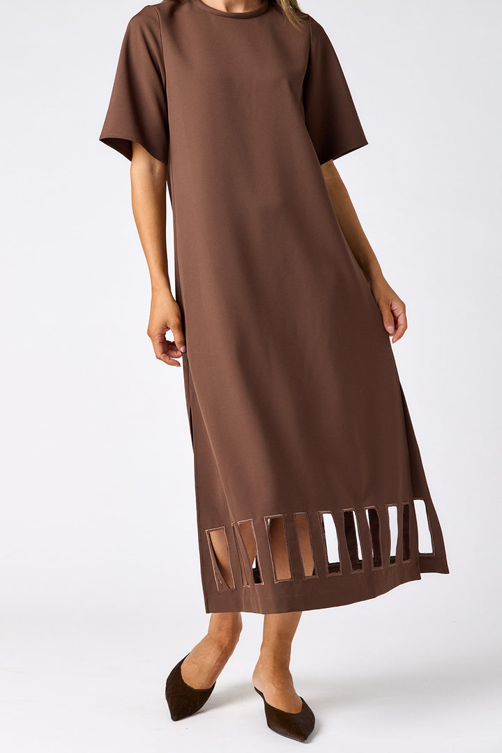 Crosby Greyson Dress in Brownie, close-up of the rectangular ladder cutouts with tonal bound edges and side slit at the hem