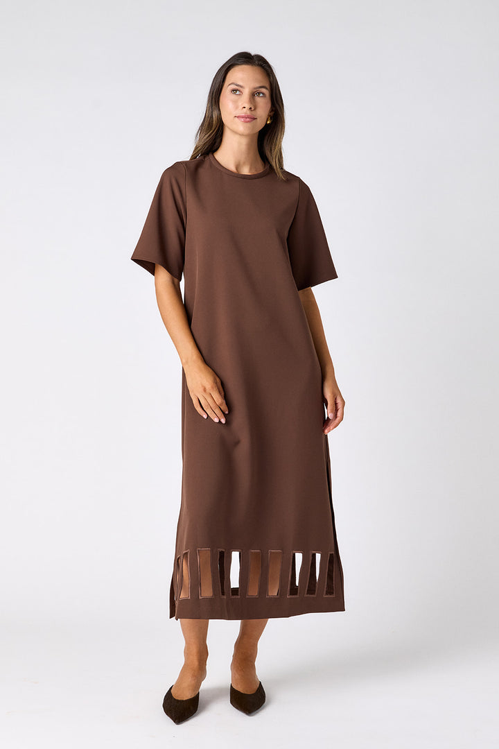 Crosby Greyson Dress in Brownie, front view on model with crew neckline, short sleeves, midi length, and cutout hem band