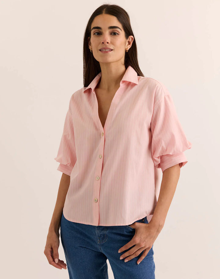Hinson Wu Lilian Elbow Sleeve Pencil Stripe Shirt in blush pink pinstripe, styled with a point collar and tiered bubble sleeve, worn with medium-wash denim against a neutral backdrop.