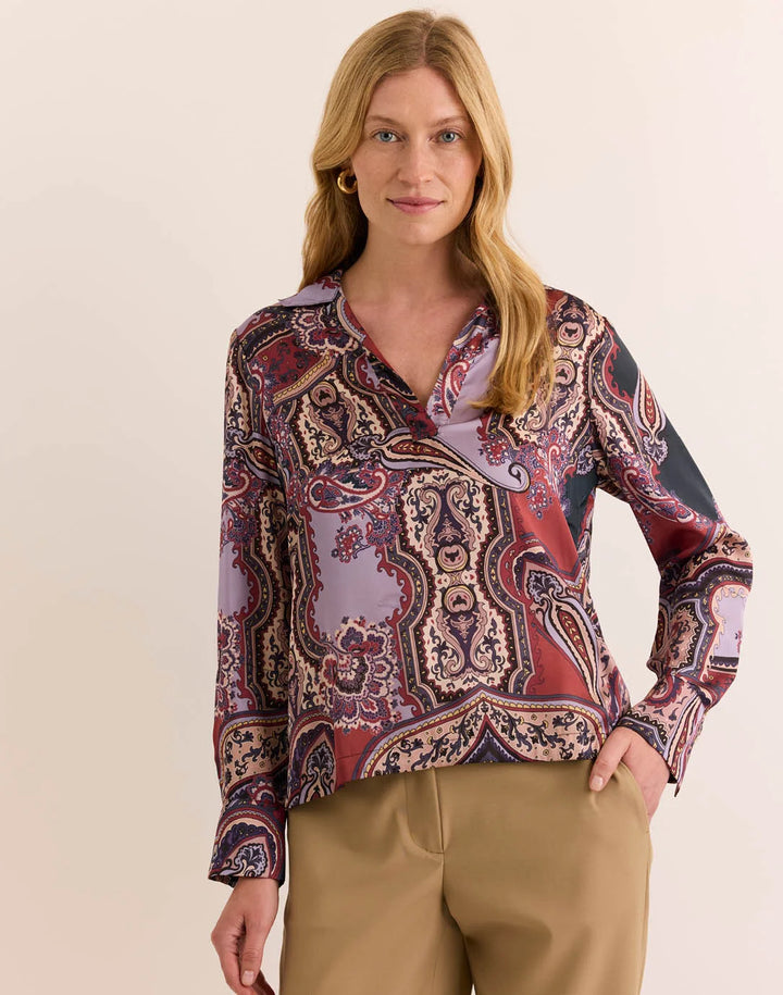 Hinson Wu Mona Plum Paisley Long Sleeve Blouse — front/side angle on model, hand in pocket