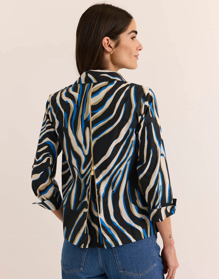 Back view of the Hinson Wu 3/4 Sleeve Xena Top highlighting the exposed gold-tone center-back zipper against the abstract zebra print.