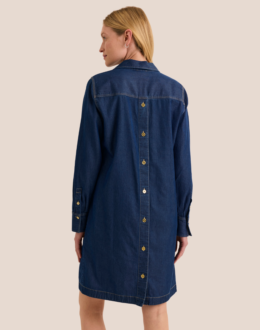 Hinson Wu Monica Dress, back view highlighting the gold button-back detail running the full length of the dress in dark wash denim.