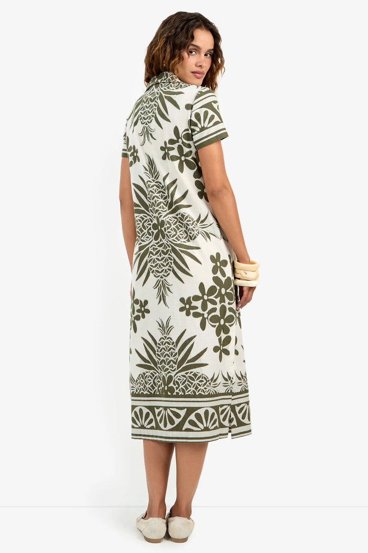 Back view of the Trina Turk Abba Midi Dress, showing the midi length and side slit.