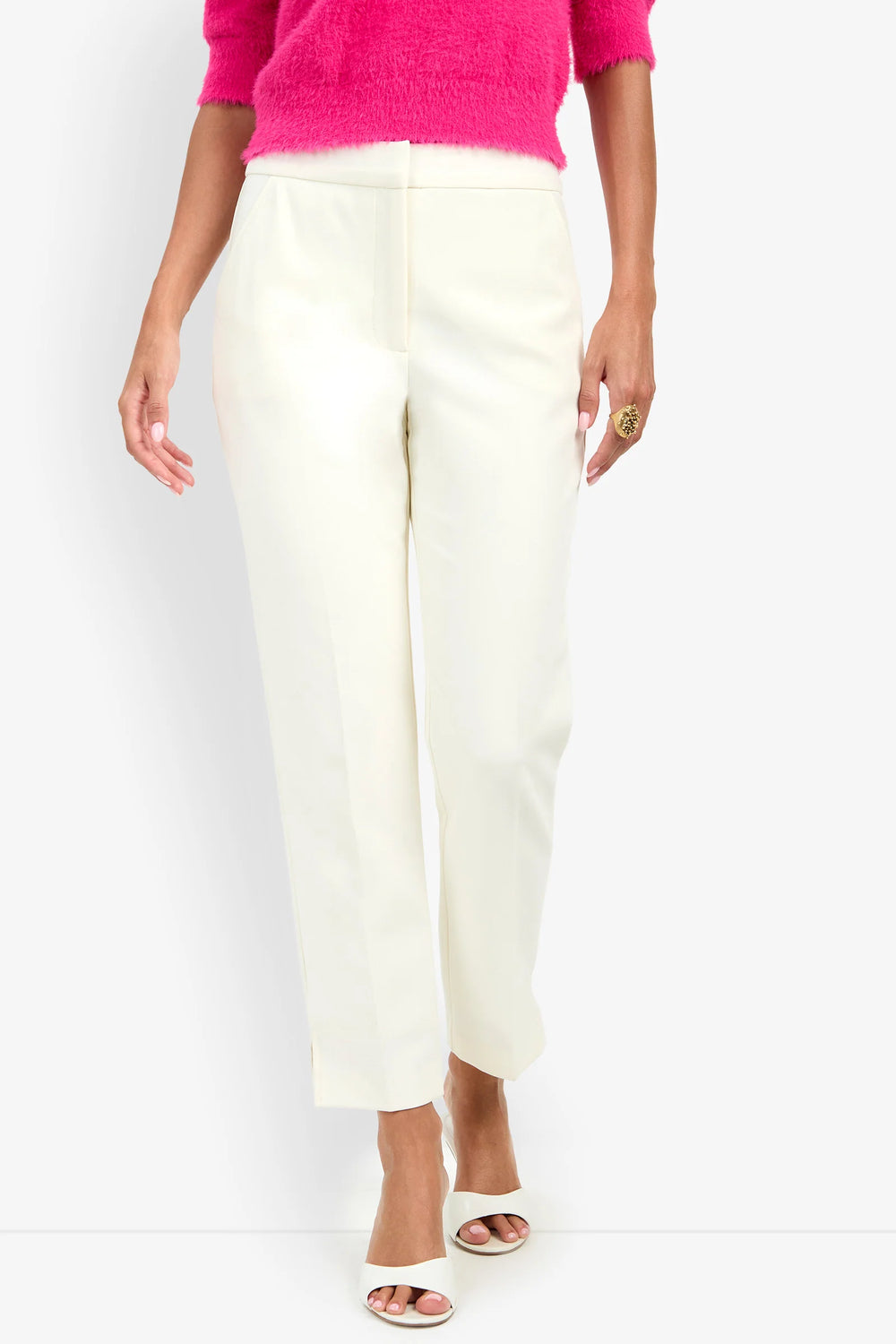 Close-up front view of the Trina Turk Arno 2 Pant in winter white highlighting the tailored waistband, concealed front closure, smooth suiting fabric, and pressed leg creases.