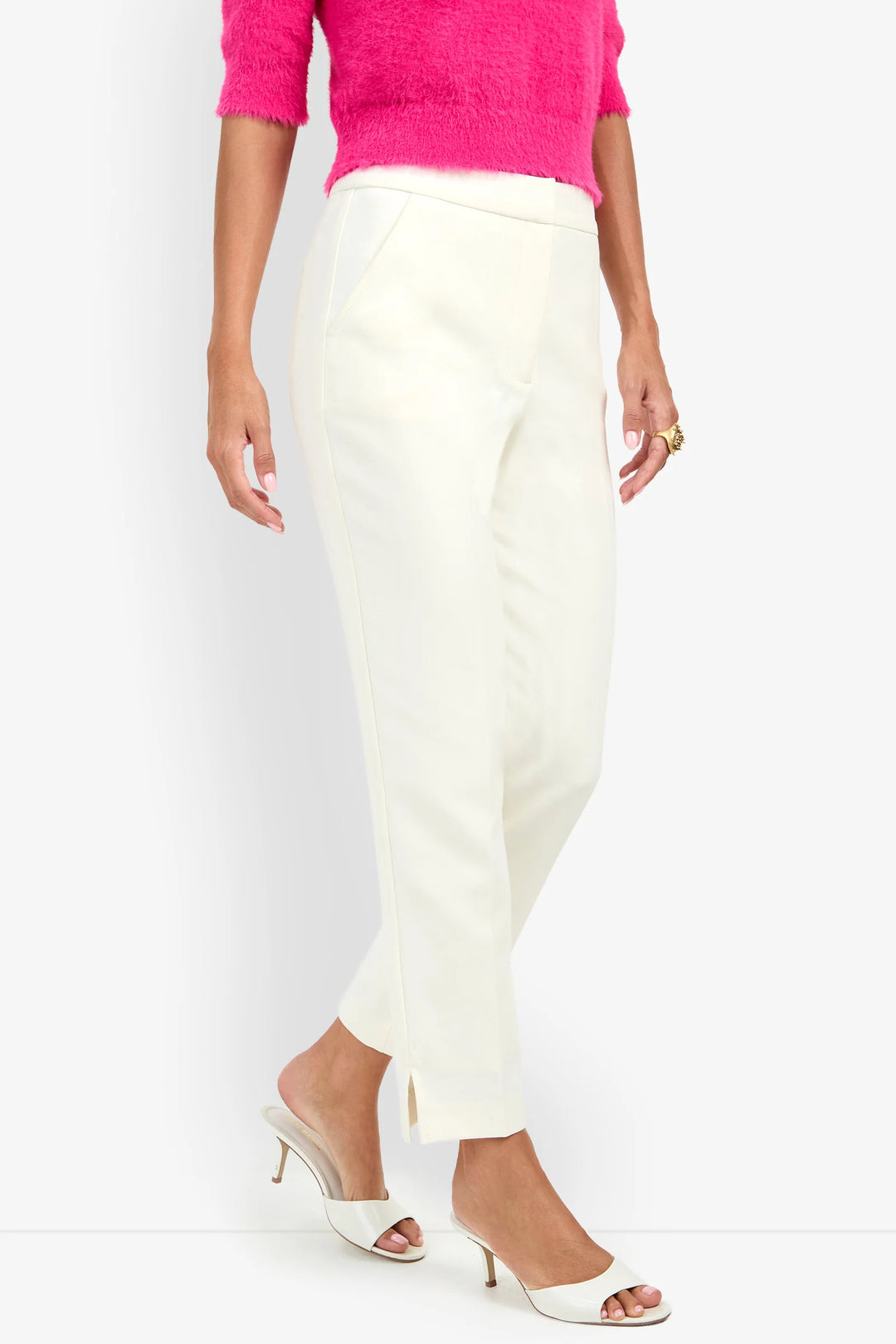 Side view of the Trina Turk Arno 2 Pant in winter white showing the slim fit, side slash pocket, ankle length, and side hem slit.