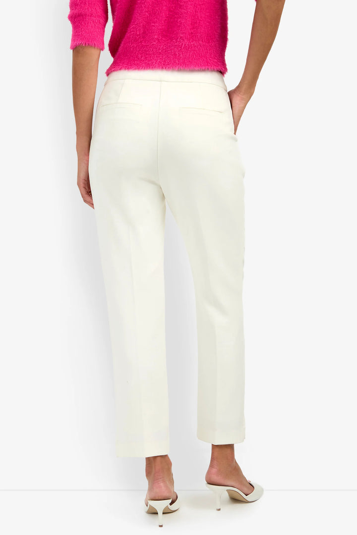 Back view of the Trina Turk Arno 2 Pant in winter white showing the slim leg, back welt pockets, tailored waistband, and ankle-length hem.
