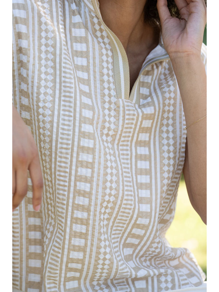 Close-up of Piazza Stripe print on textured cotton showing vertical geometric motif columns with depth and dimensional texture.