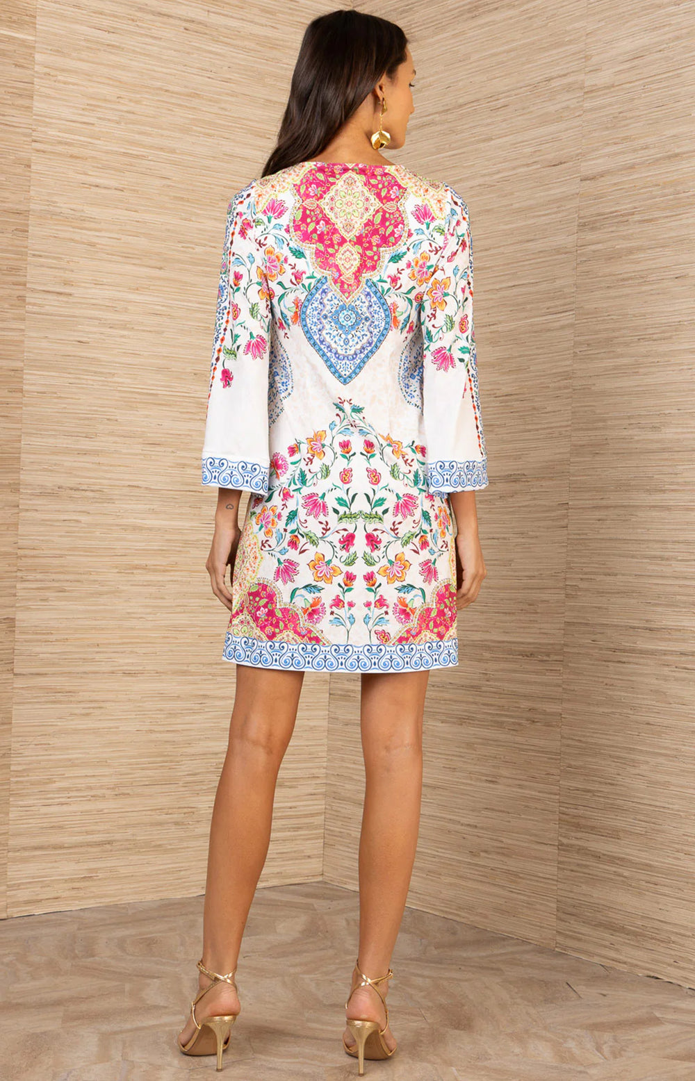 Hale Bob Dulcie V-Neck Matte Jersey Dress in ivory with multicolor floral and medallion placement print, bell sleeves with printed cuff band, and hip pockets. - back of dress