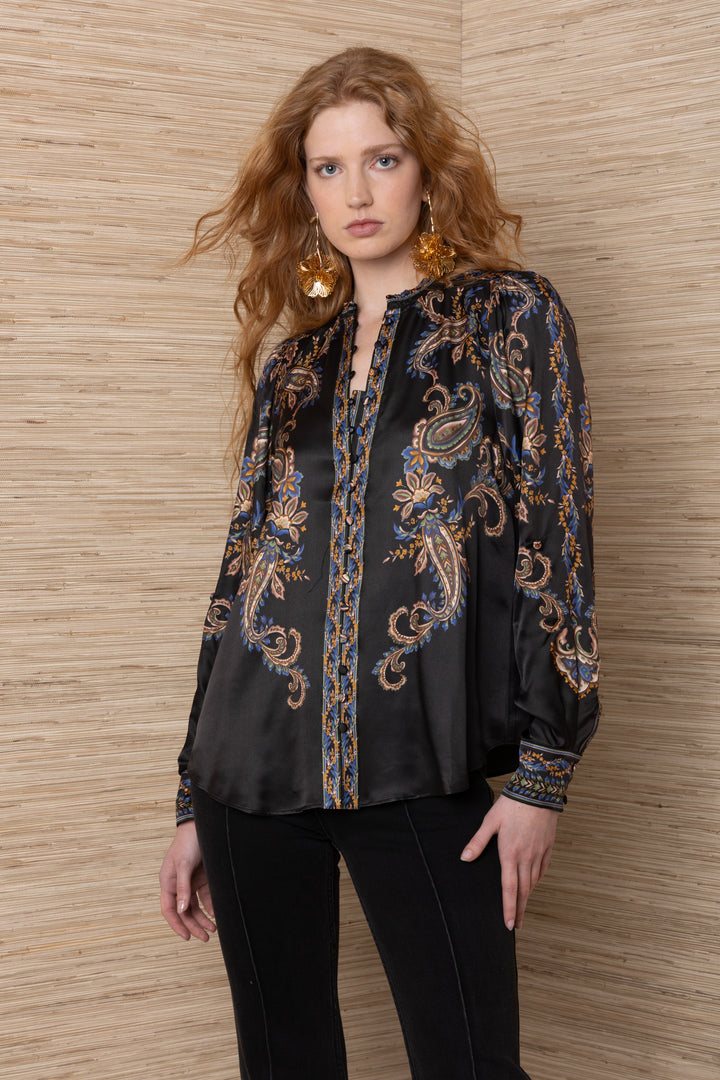 Hale Bob Beata Long Sleeve Button Down Blouse in Black Multi, front view on model, showing split V neckline with smocked edge, gathered shoulders, and border-print button cuffs.