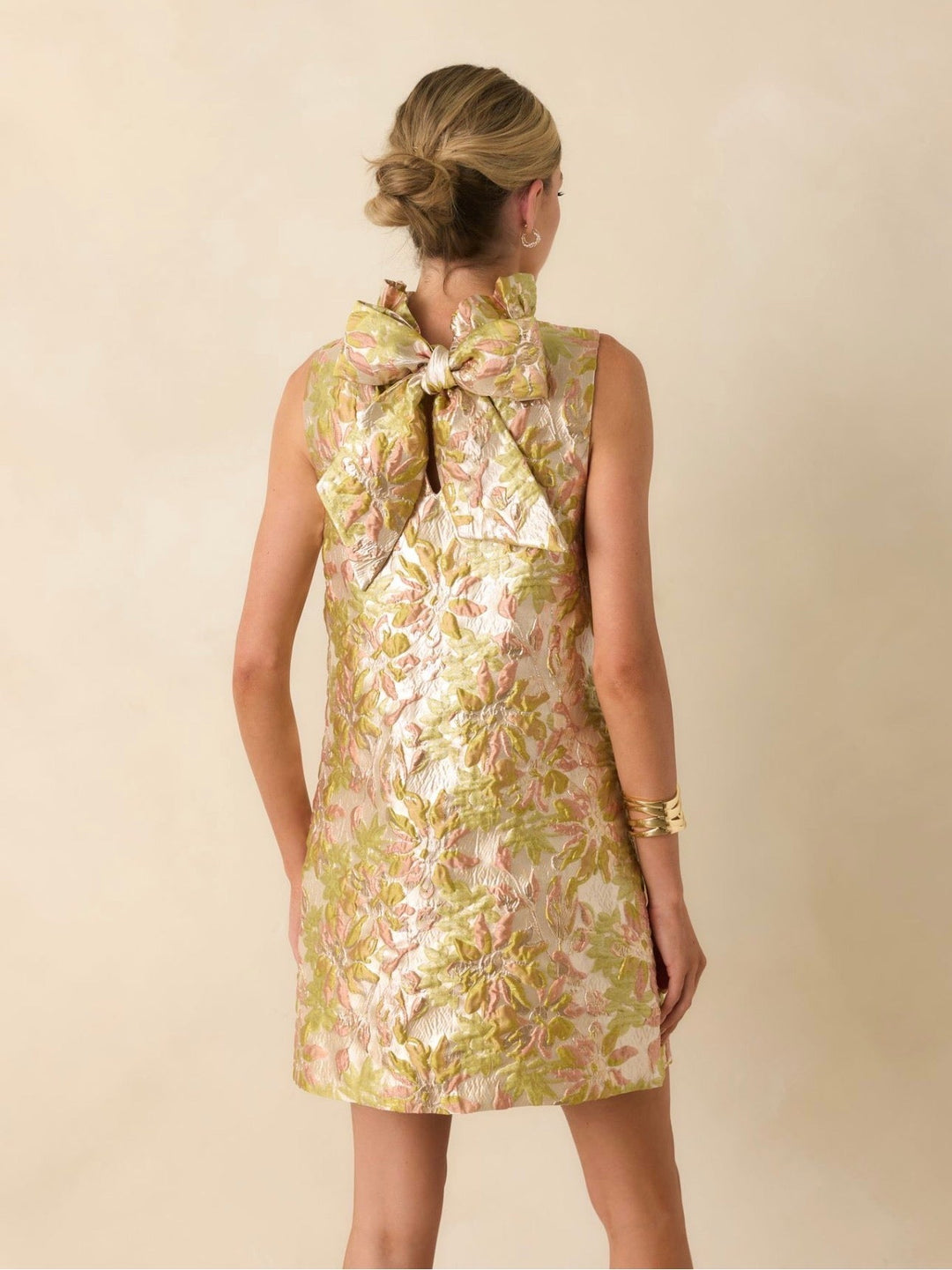 Prosperina Cecily Mini Dress, back view showing oversized bow detail and floral jacquard print.