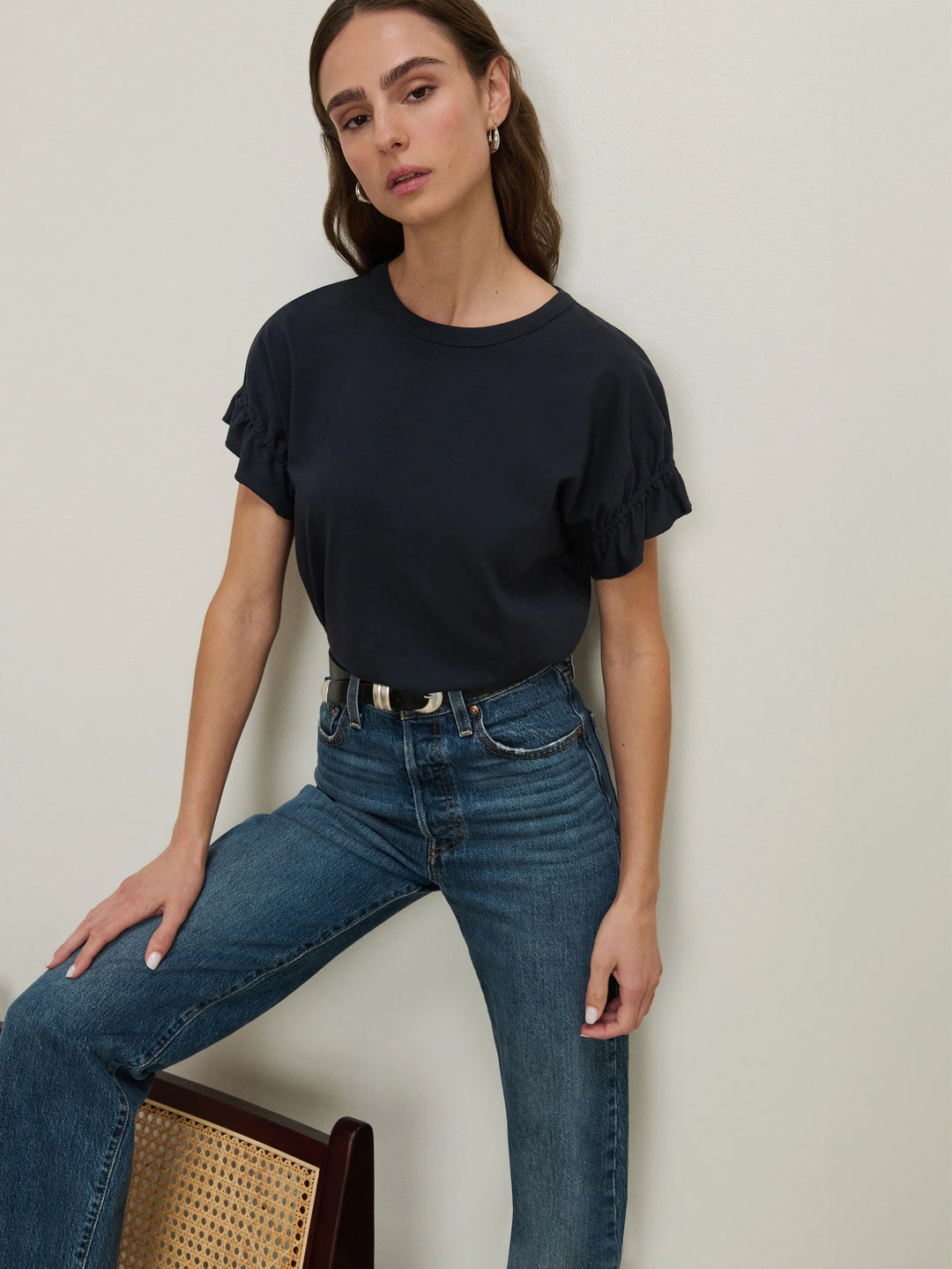 Front view of model wearing the Nation Los Angeles Arline Short Sleeve Top tucked in Night Sky with denim.