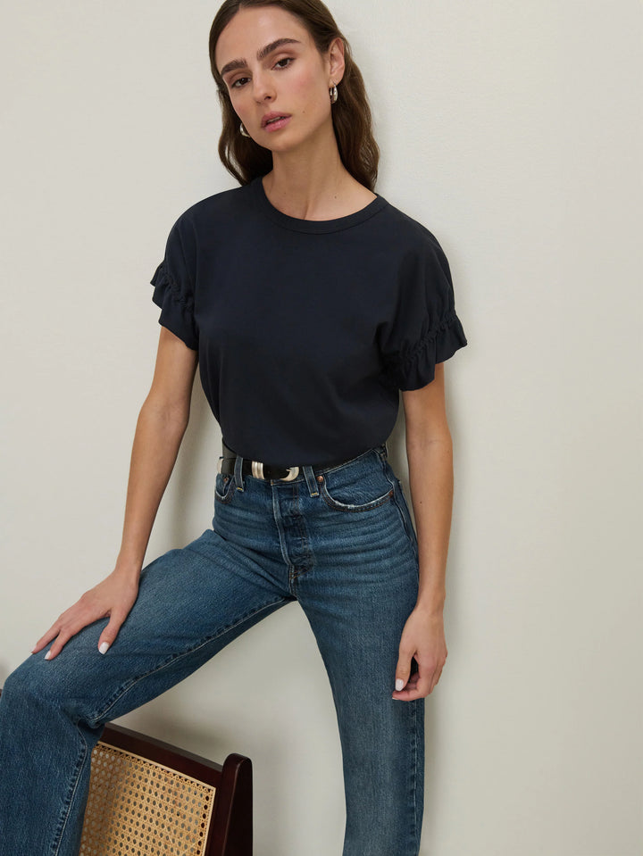 Front view of model wearing the Nation Los Angeles Arline Short Sleeve Top tucked in Night Sky with denim.
