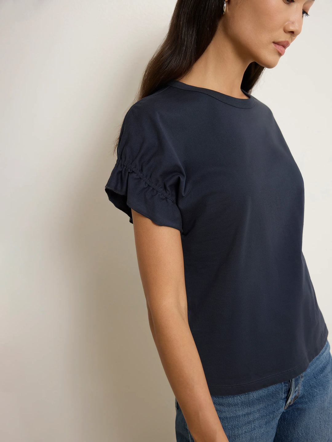 Close-up detail of the gathered ruffle sleeve on the Nation Los Angeles Arline Short Sleeve Top in Night Sky.
