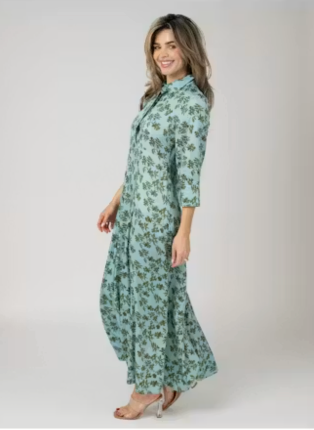 Side view of the Beau &amp; Ro Alexa Dress in Blue Wiley Floral, highlighting the 3/4-length sleeve and center front slit, worn with strappy heeled sandals.