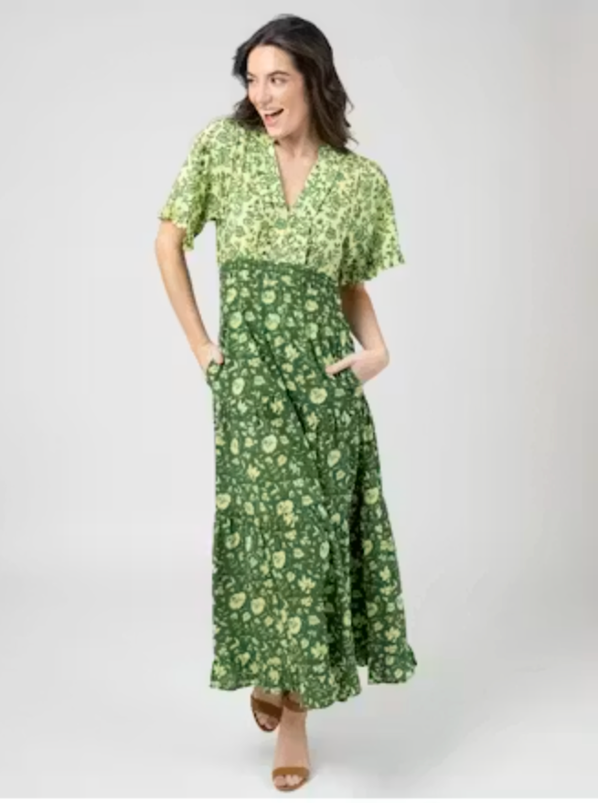 Front view of the Beau &amp; Ro Anya Dress in Jaipur Green, showing the tiered floral skirt and flutter sleeve, styled with brown sandals.