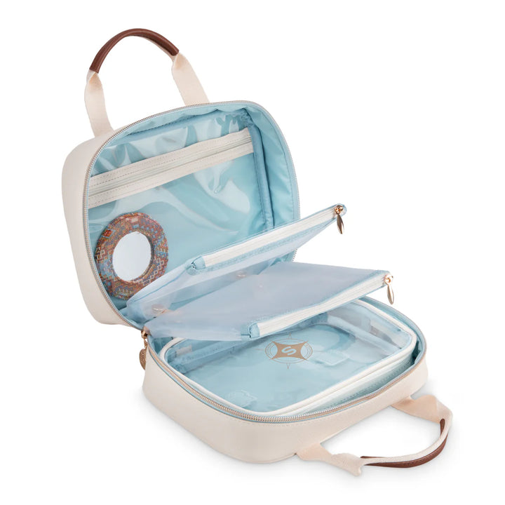 Interior detail view 2: Stephanie Johnson ML Traveler shown open and empty, highlighting pale blue lining, clear zip pocket, removable clear zip pouch, lift-out clear-topped tray, and round mirror compact in kilim print.