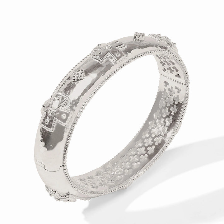 Julie Vos Canterbury Hinge Bangle in silver plate — wide hammered band with cross motif and milgrain detail, shown standing upright on white background.
