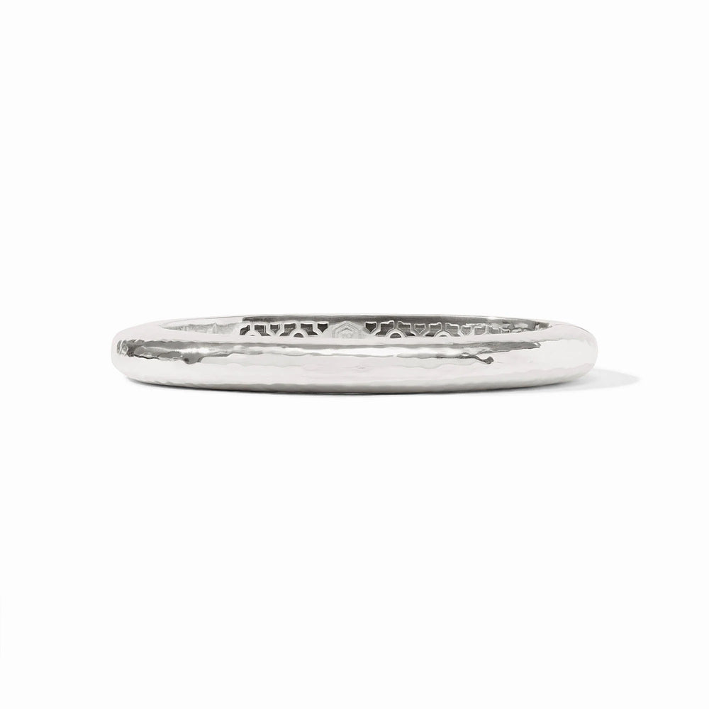 Julie Vos Catalina Hinge Bangle in silver plate — smooth hammered oval band with engraved interior detailing and Julie Vos hallmark, shown standing upright on white background.