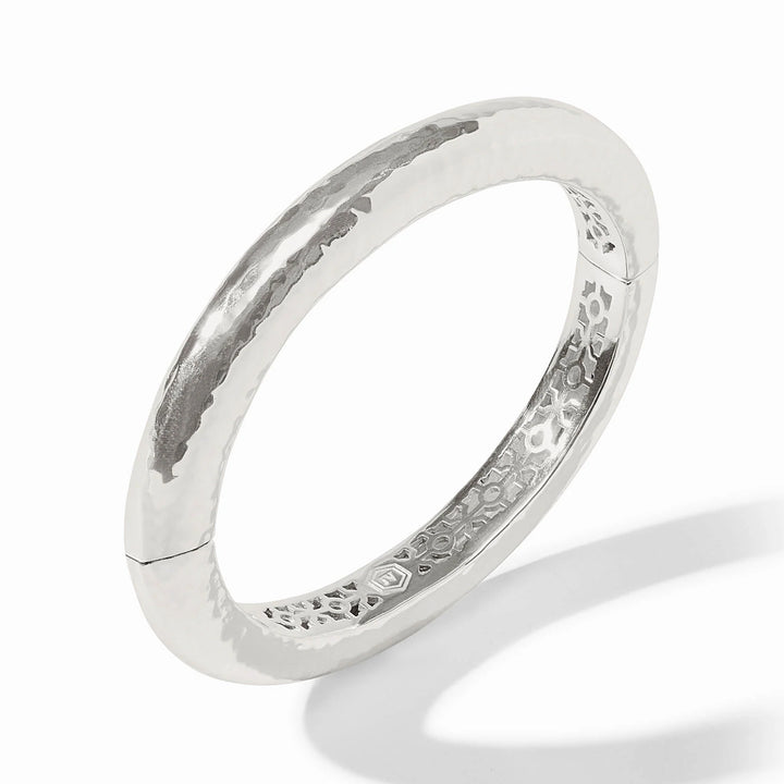Julie Vos Catalina Hinge Bangle in silver plate — smooth hammered oval band with engraved interior detailing and Julie Vos hallmark, shown standing upright on white background.