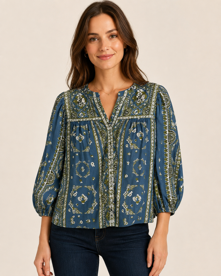 Cleobella Imogen Top in Fioren Print, front view, model wearing blue botanical-print blouse with button placket and dark denim.
