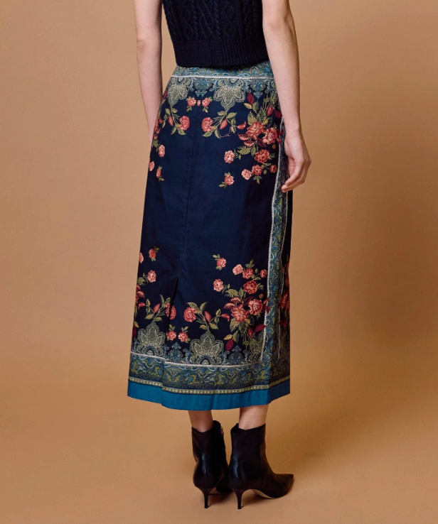 Cleobella Milena Midi Skirt in Eglantine Print, back view, showing center back slit and paisley border detail.