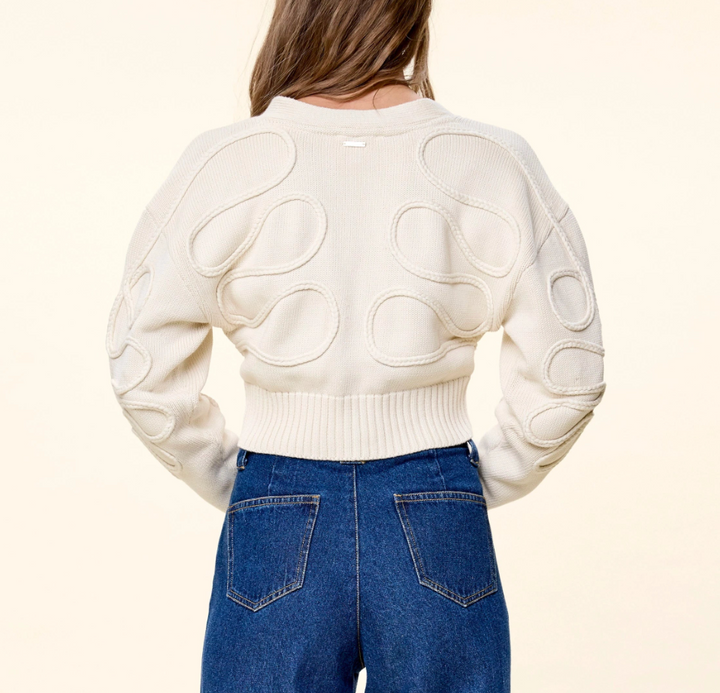 Cleobella The Cher Sweater in Ivory — back view on model showing knit pattern and logo plate