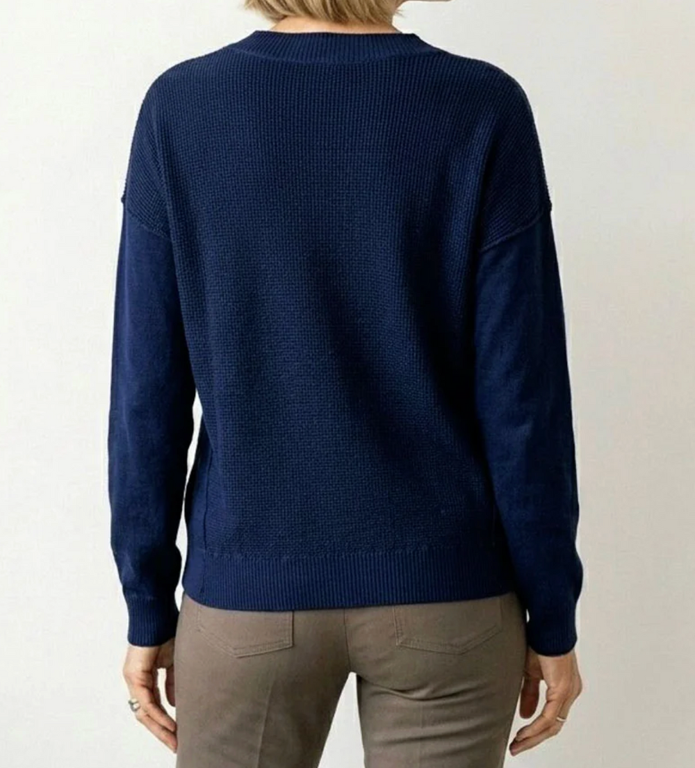 Elliott Lauren V-Neck Waffle Body Sweater in Indigo, back view, showing waffle-textured back panel and ribbed hem.