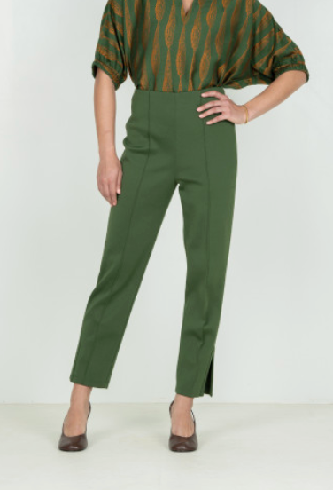 Emily McCarthy Slim Pant Black Forest – front view on model, cropped at shoulders, hand on hip