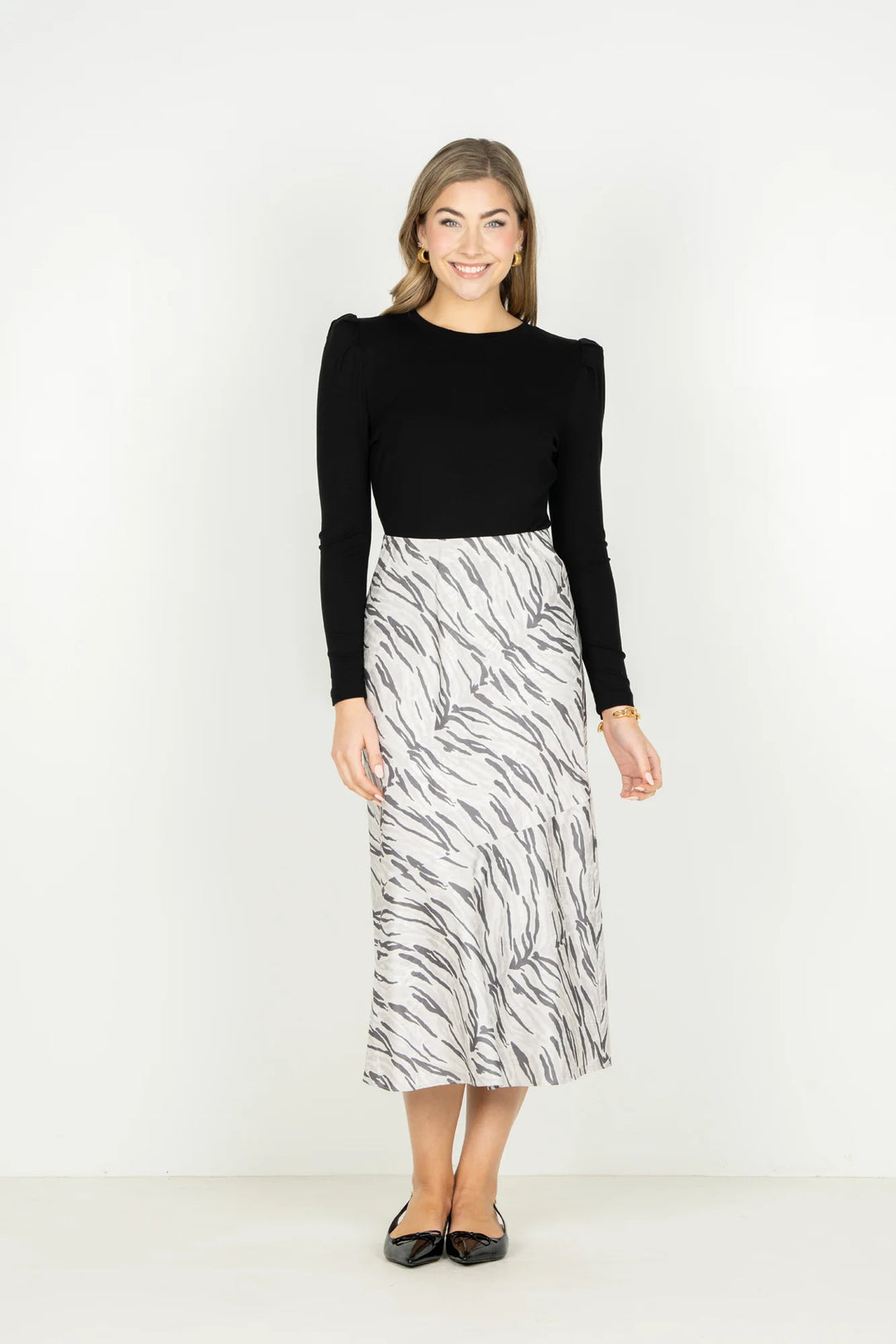 Emily McCarthy Bias Midi Skirt in Wild Marble — front view styled with black long-sleeve top