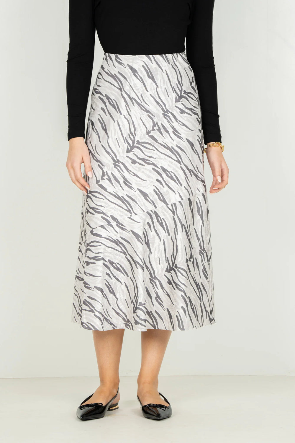 Emily McCarthy Bias Midi Skirt in Wild Marble — front detail view showing bias seaming and print placement