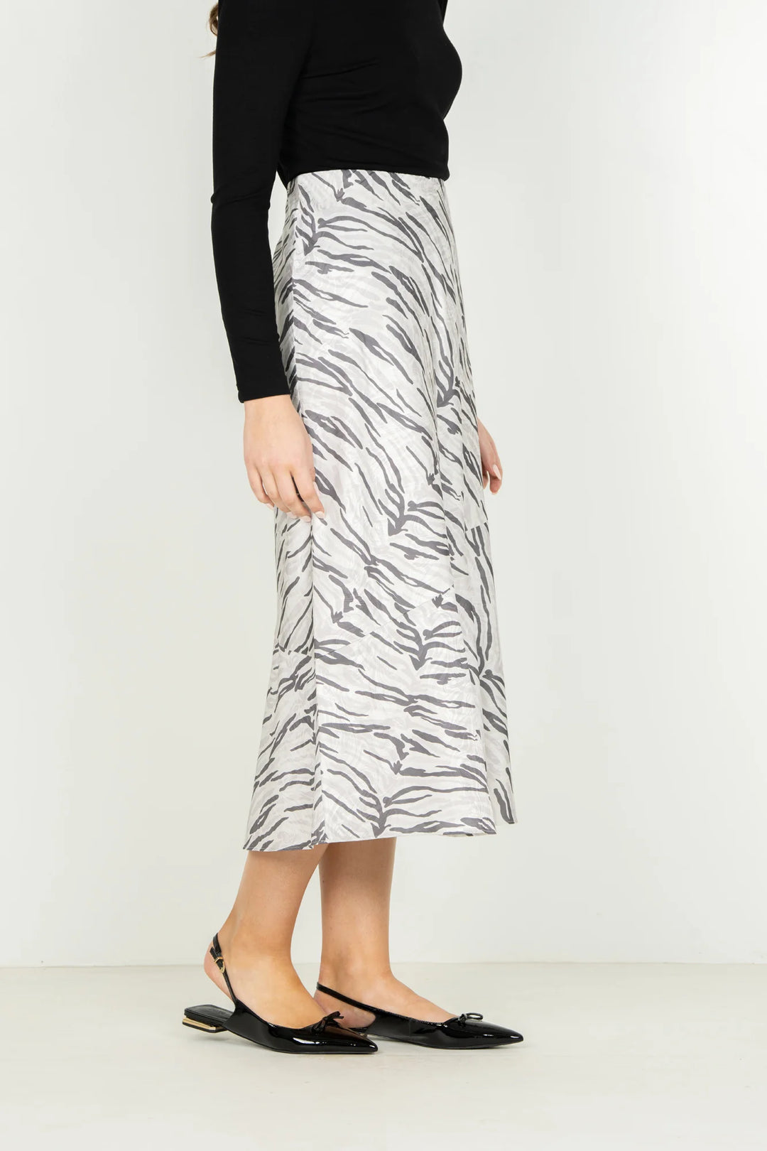 Emily McCarthy Bias Midi Skirt in Wild Marble — side view showing bias-cut drape and hem flare