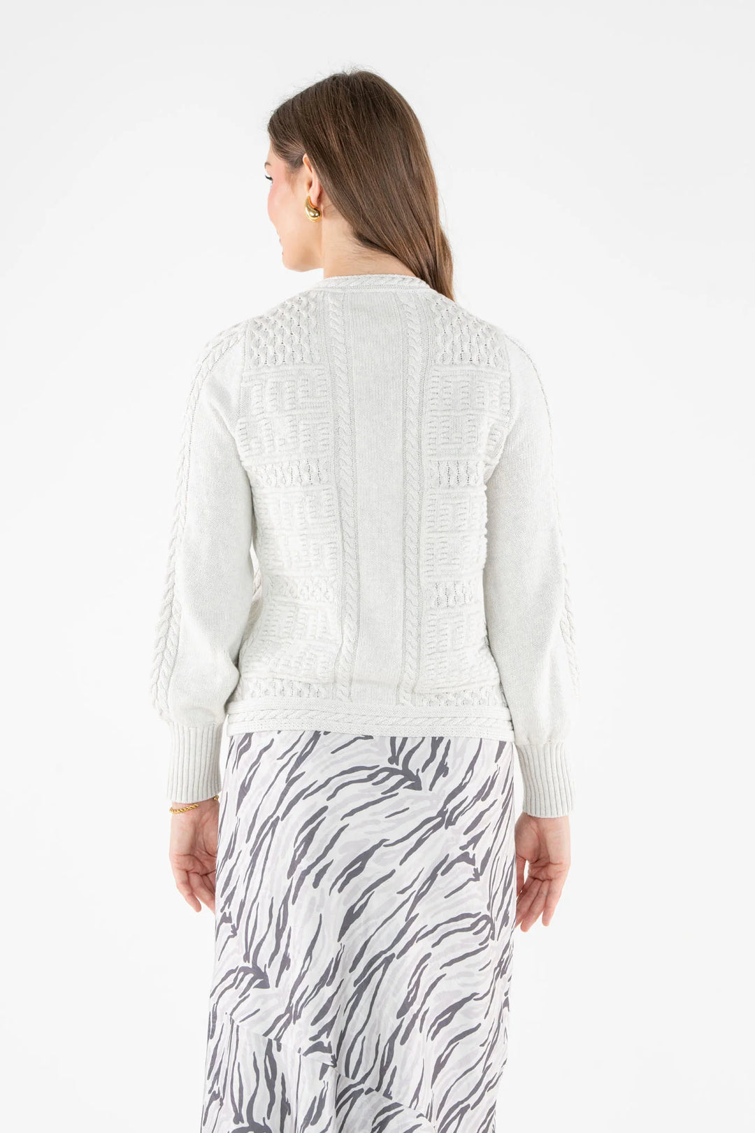 Emily McCarthy Chloe Cardigan in Carrara — back view showing cable-knit detailing and silhouette