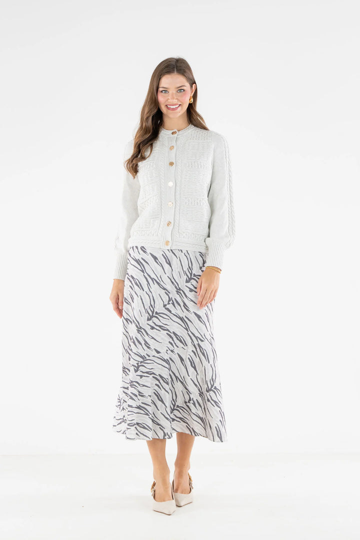 Emily McCarthy Chloe Cardigan in Carrara — front view styled with Wild Marble bias midi skirt