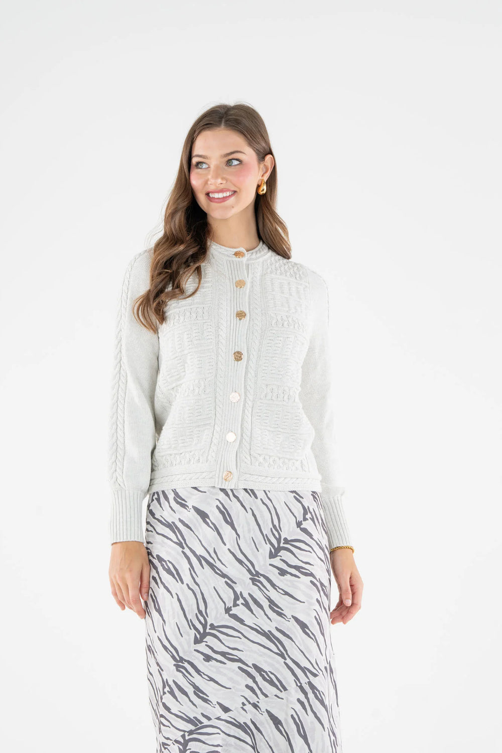Emily McCarthy Chloe Cardigan in Carrara — front view, alternate angle showing button placket and cable knit