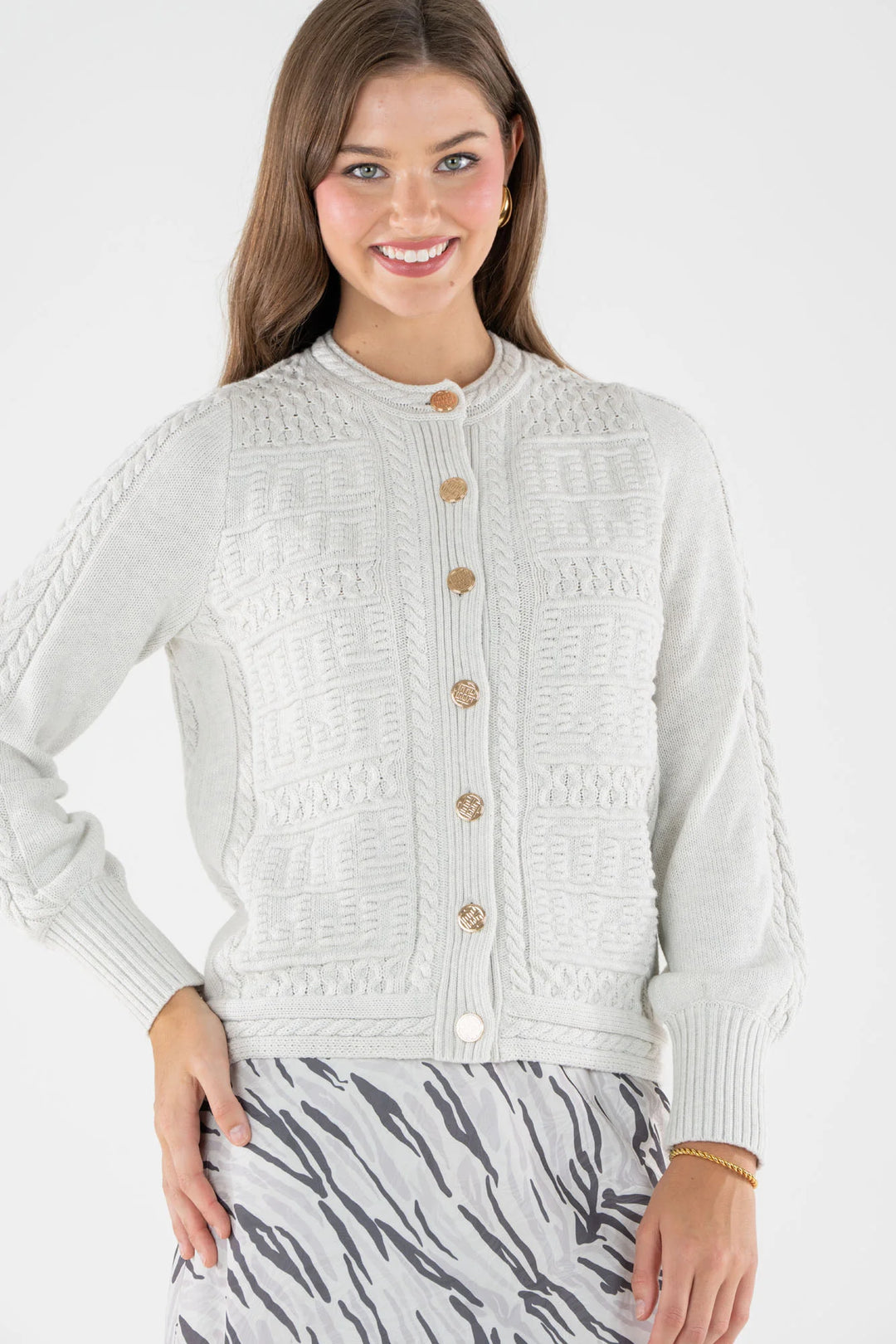 Emily McCarthy Chloe Cardigan in Carrara — close-up front view showing monogram knit texture and buttons