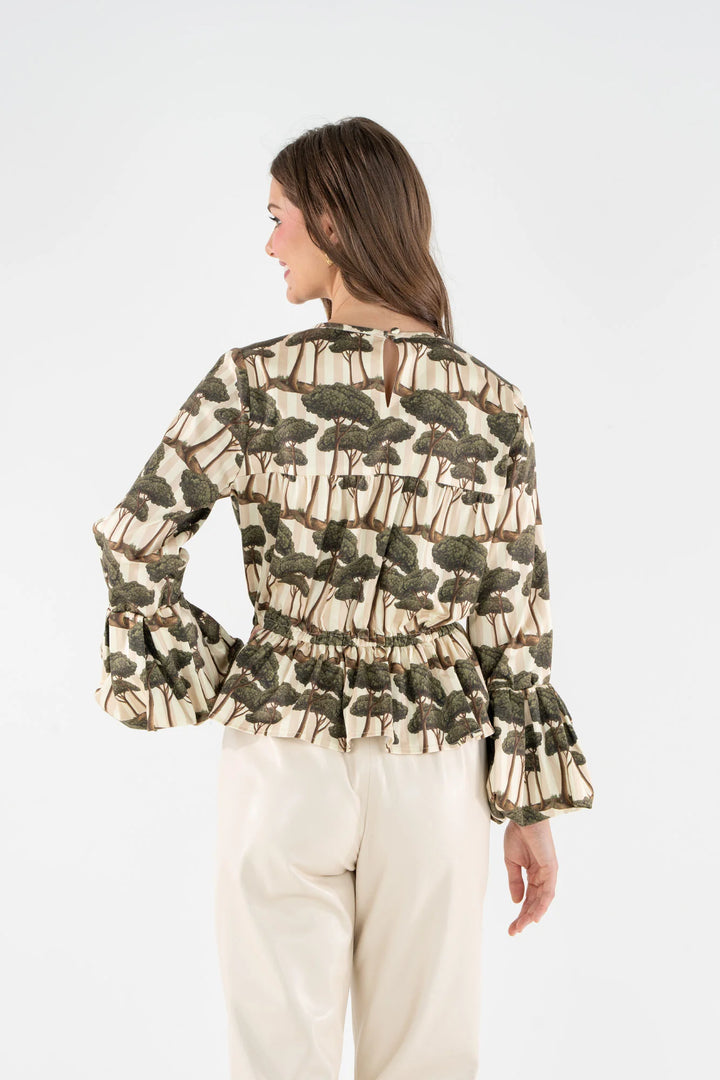 Back view of the Umbrella Pine print Harper Top showing the peplum waist and concealed zipper.