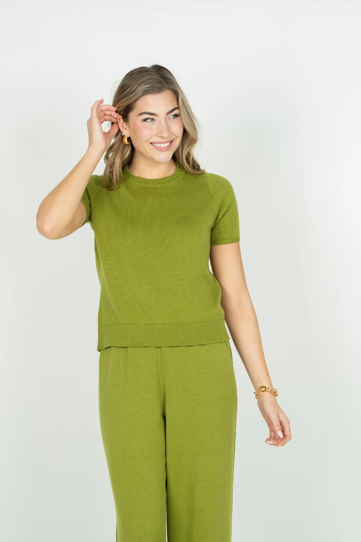 Emily McCarthy Joy Tee in Cardamom — front view styled with matching green wide-leg lounge pant