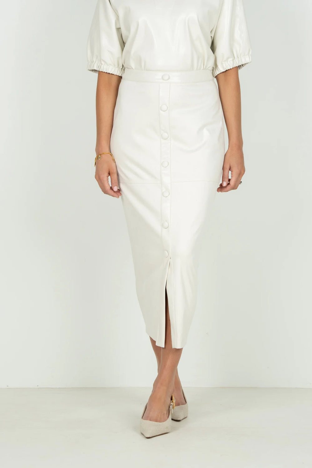 Emily McCarthy Pencil Skirt in Carrara — front detail view showing button placket and center slit