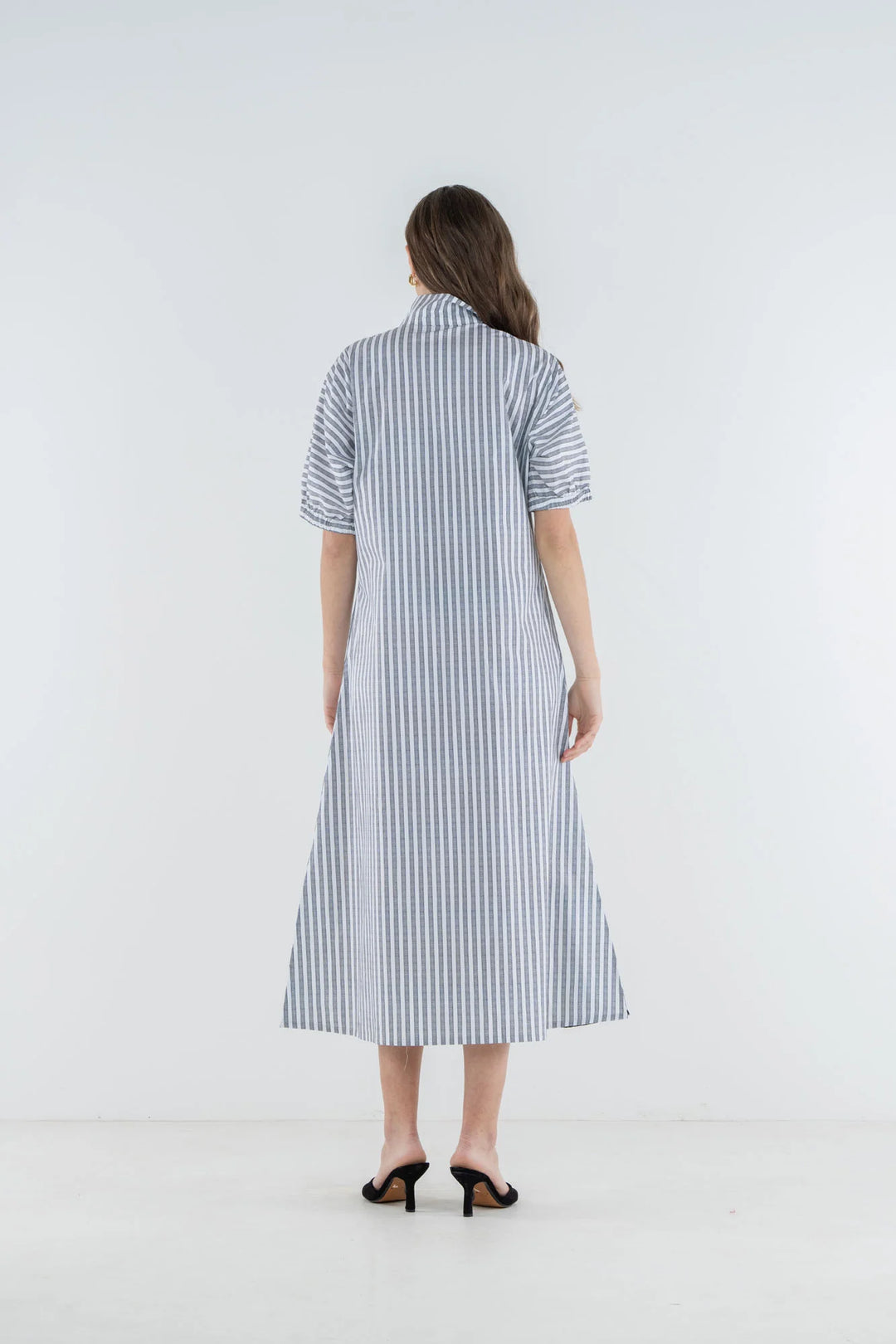 Emily McCarthy Poppy Maxi Dress in Black Stripe — back on-model, full length