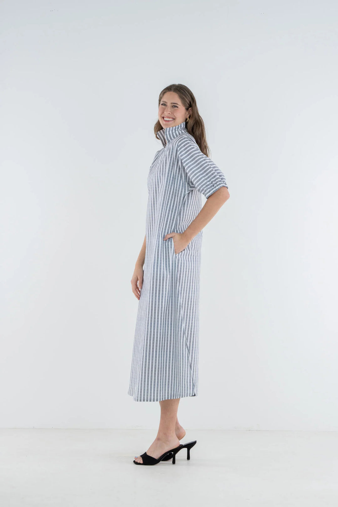 Emily McCarthy Poppy Maxi Dress in Black Stripe — side profile on-model, showing sleeve volume and A-line drape