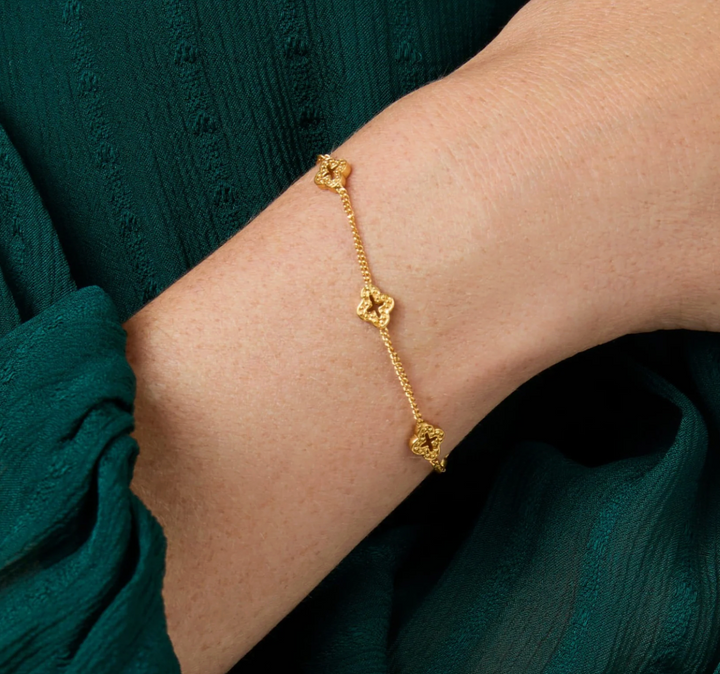 Julie Vos Florentine Delicate Bracelet, on-model wrist detail showing quatrefoil stations