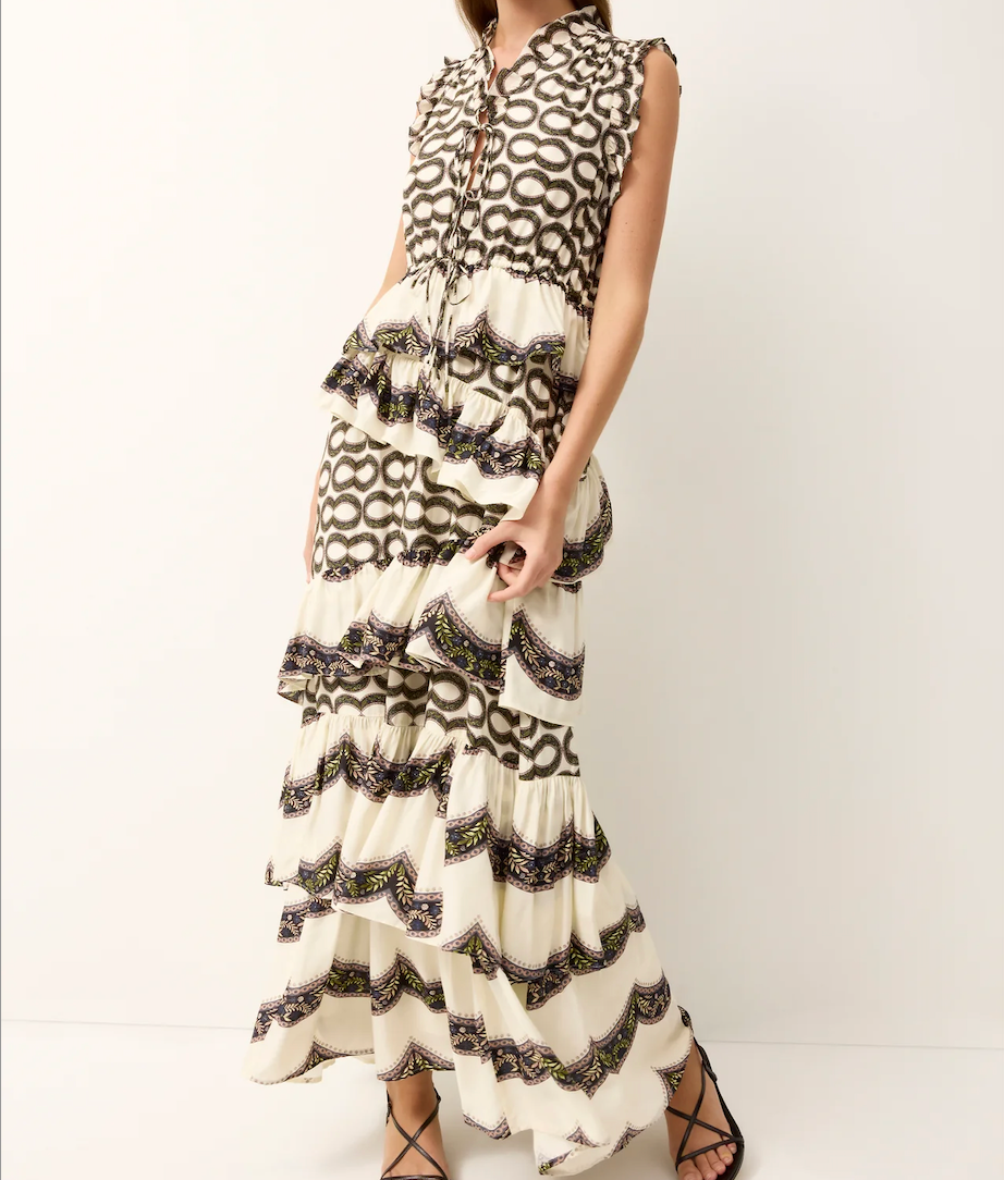 Woman wearing a black and white patterned dress on a white background