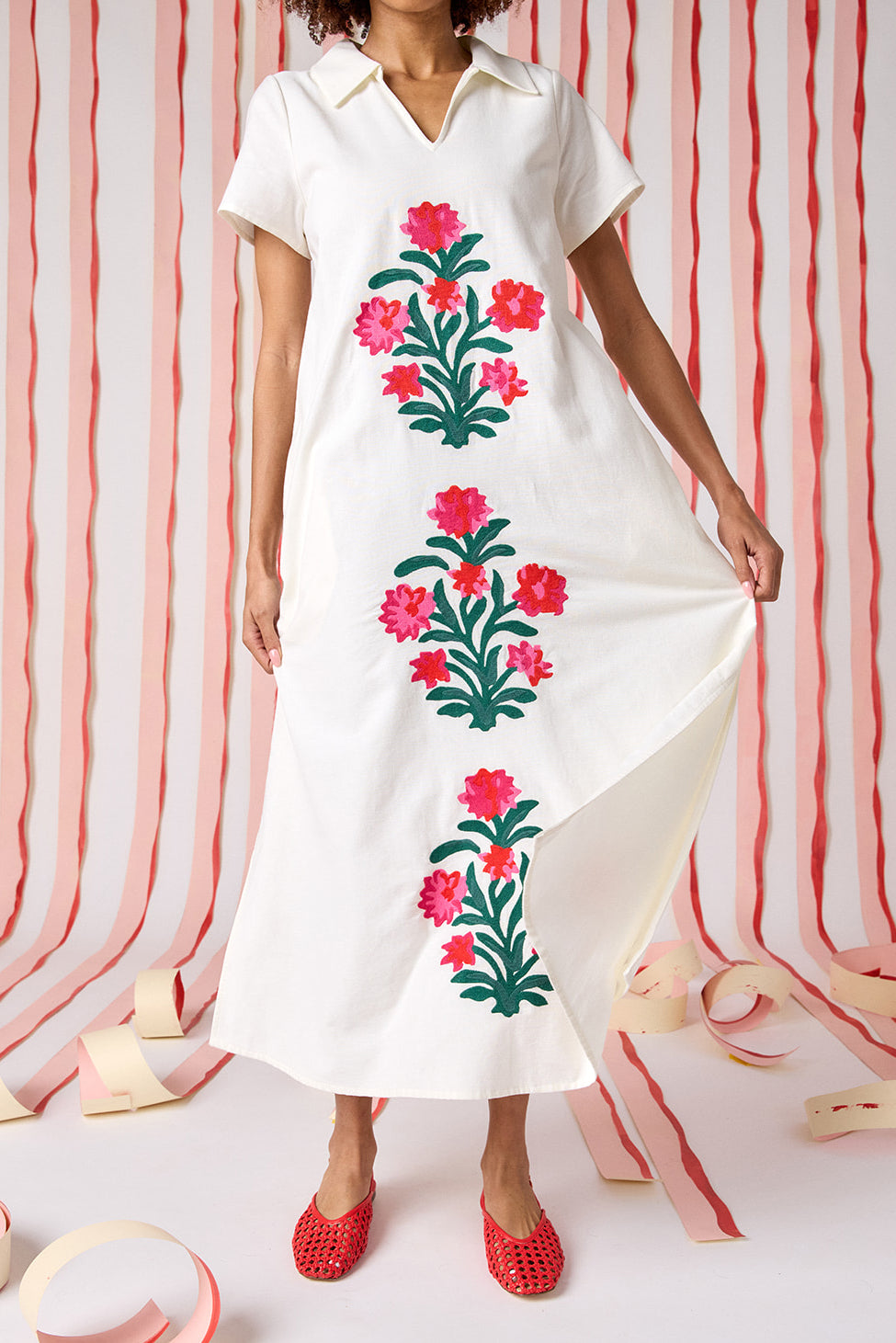 Model wearing Crosby Franny Embroidered Maxi Dress in ivory. Dress features cascading floral embroidery down the front, relaxed A-line silhouette, short sleeves, and polo-style open collar.