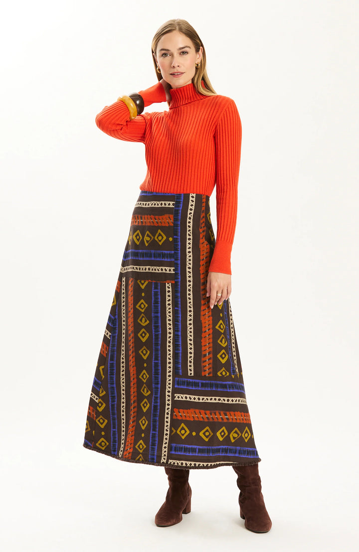 Tyler Boe Val Rails Stripe Skirt, front view on-model, full-length styled with ribbed turtleneck