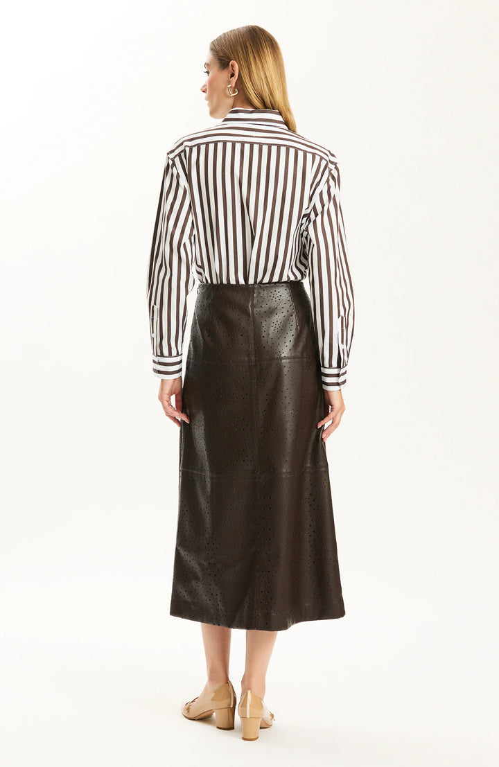 Back view of the A-line skirt silhouette with striped shirt tucked at the waist.
