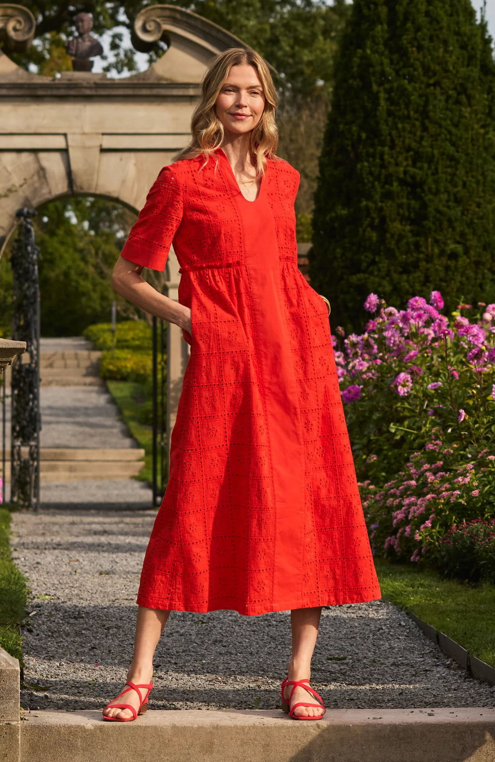 Model wearing Tyler Boe Lane Eyelet Maxi Dress in grenadine, full-length front view, styled outside.