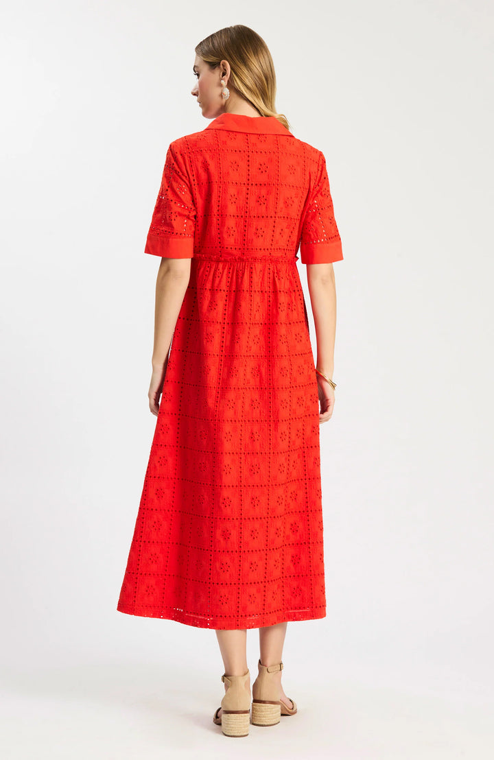 Model wearing Tyler Boe Lane Eyelet Maxi Dress in grenadine, full-length front view, styled with tan block-heel sandals and floral earrings, on white background. - backside
